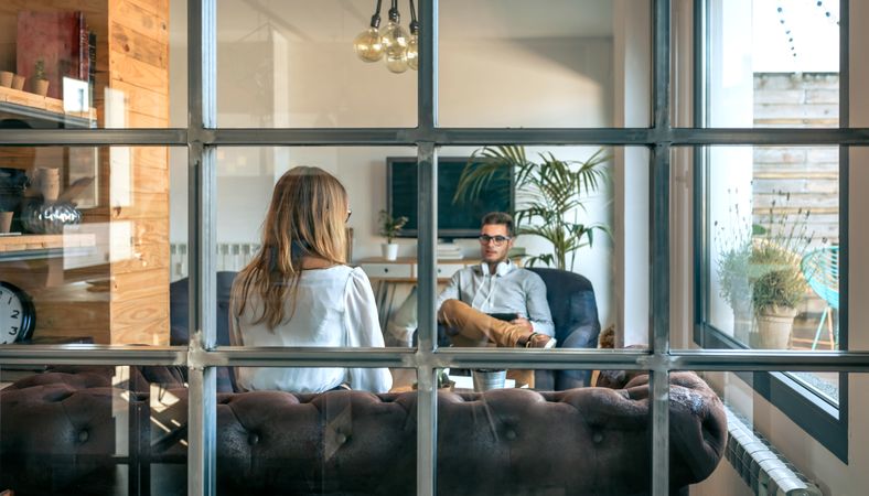 Two people in an informal business meeting