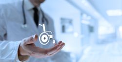 Doctor Reveals Wheelchair Icon in Palm