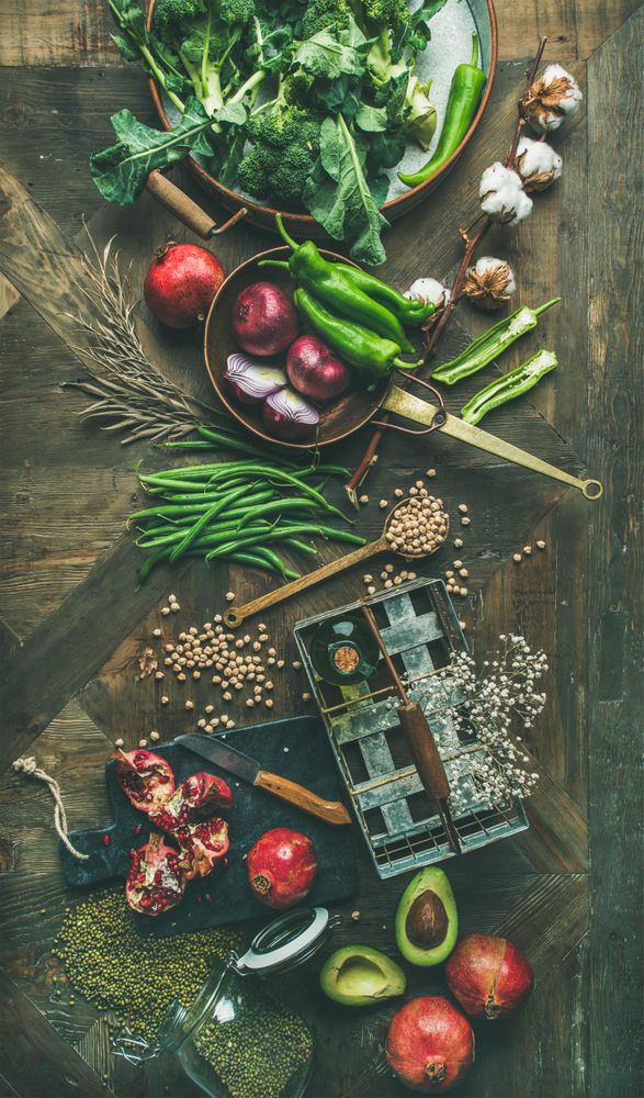 Fresh raw vegetables, fruit, grains, and oil ready for healthy dinner recipe