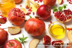 Close up of pomegranate with apples, honey and mint leaves 5nJnA5