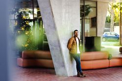 Stylish man outside modern building