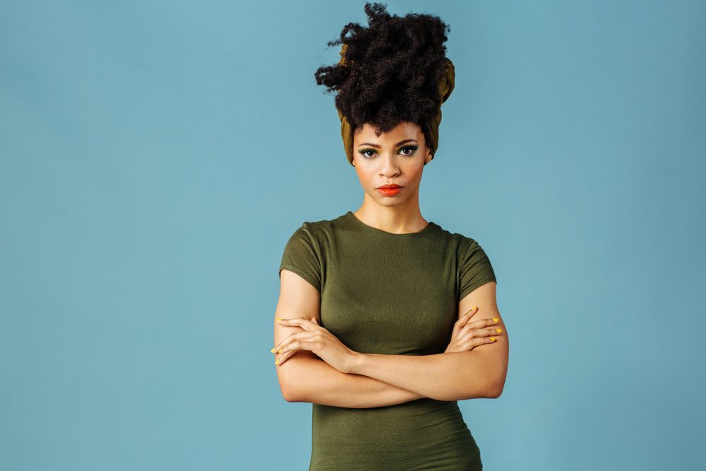 Studio shoot of Black woman with arms crossed