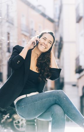 Young female walking with smartphone