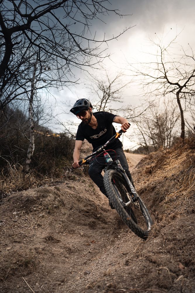 Man riding a bike on dirt road