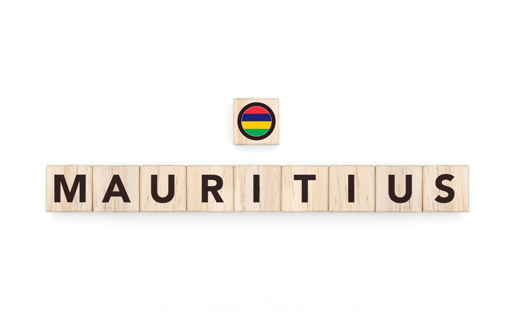 Wooden blocks bearing the name and flag of Mauritius. Mauritian and Indian Ocean Culture, national identity, travel, and geography in a copy space design.