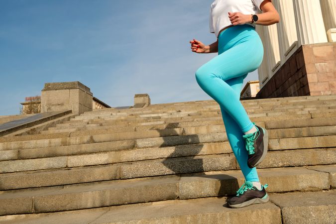 Young woman jogging on city streets