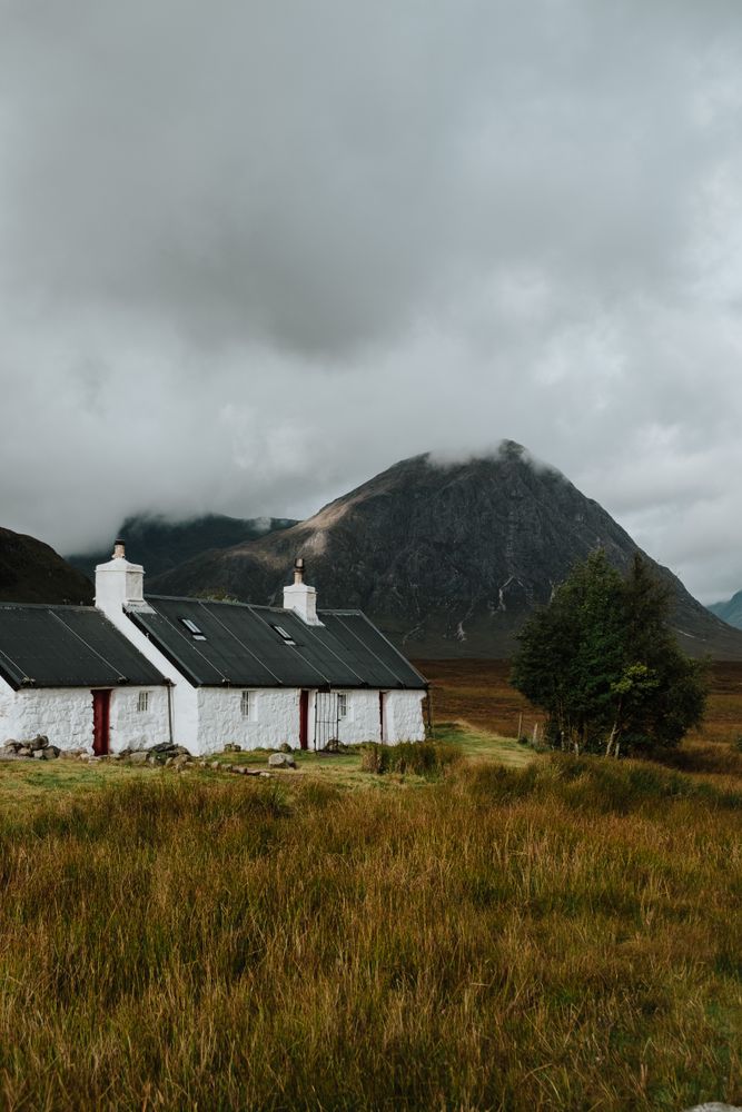Lonely house in autumn field in Scotland