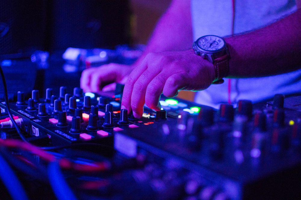 Man playing on audio mixer
