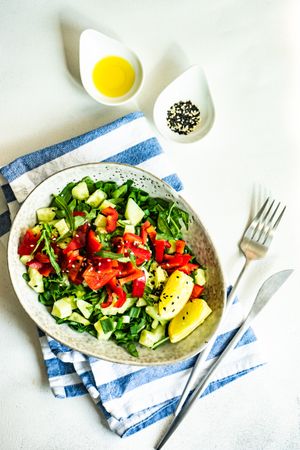 Top view of bowl of fresh organic vegetable salad