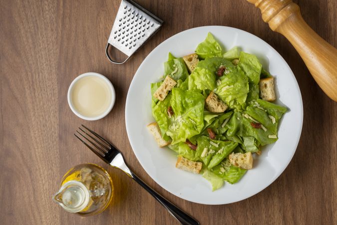 Caesar salad with croutons and bacon.