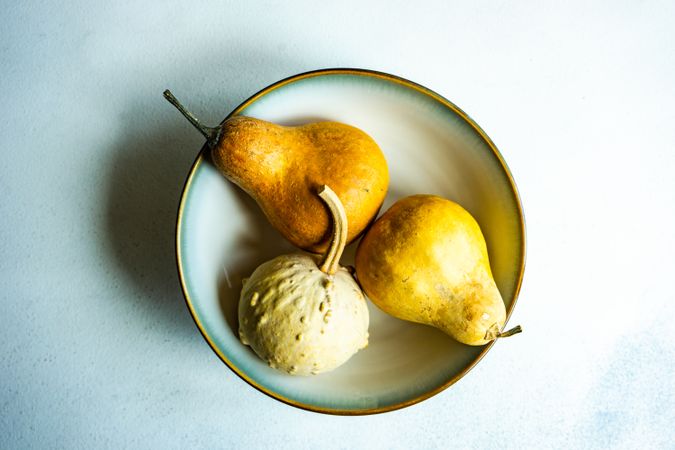 Top view of bowl with squash and pears with copy space