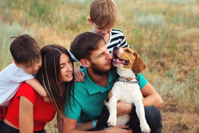 Family walk and training dog