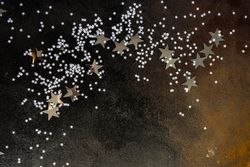 Christmas card concept of silver stars on table