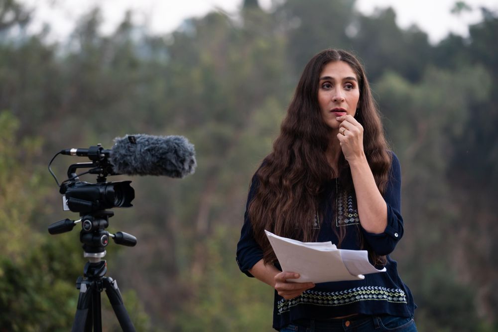 Female director looking pensively at a scene