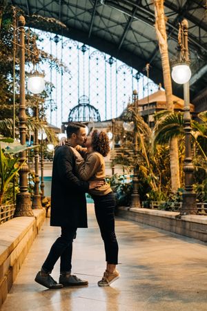 Happy couple hugging in pavilion