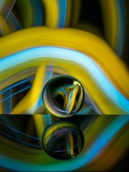 Crystal ball on board near abstract shines