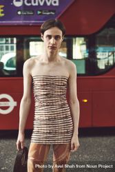 London, England, United Kingdom - September 18 2021: Person in form fitting shirt in front of a bus 5ovMm0