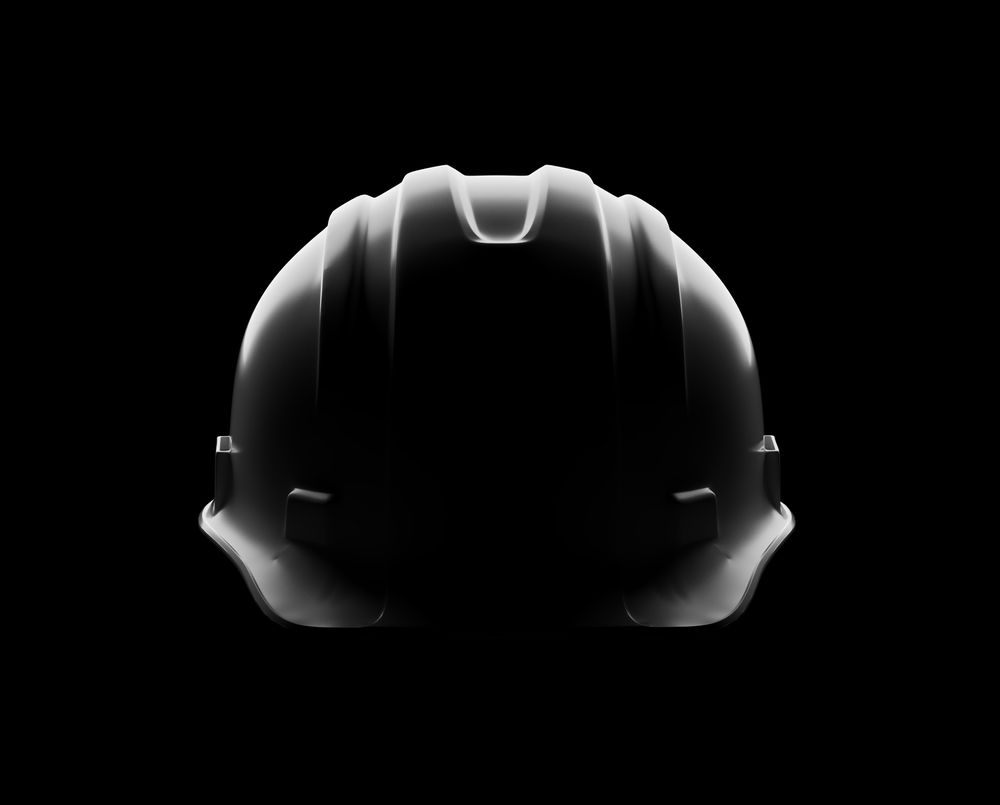Dramatically Lit Hard Hat Isolated on a Dark Background.