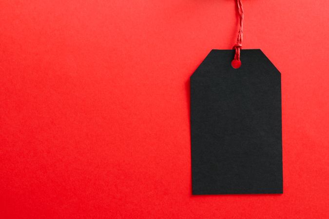 Blank tag on red background, space for text