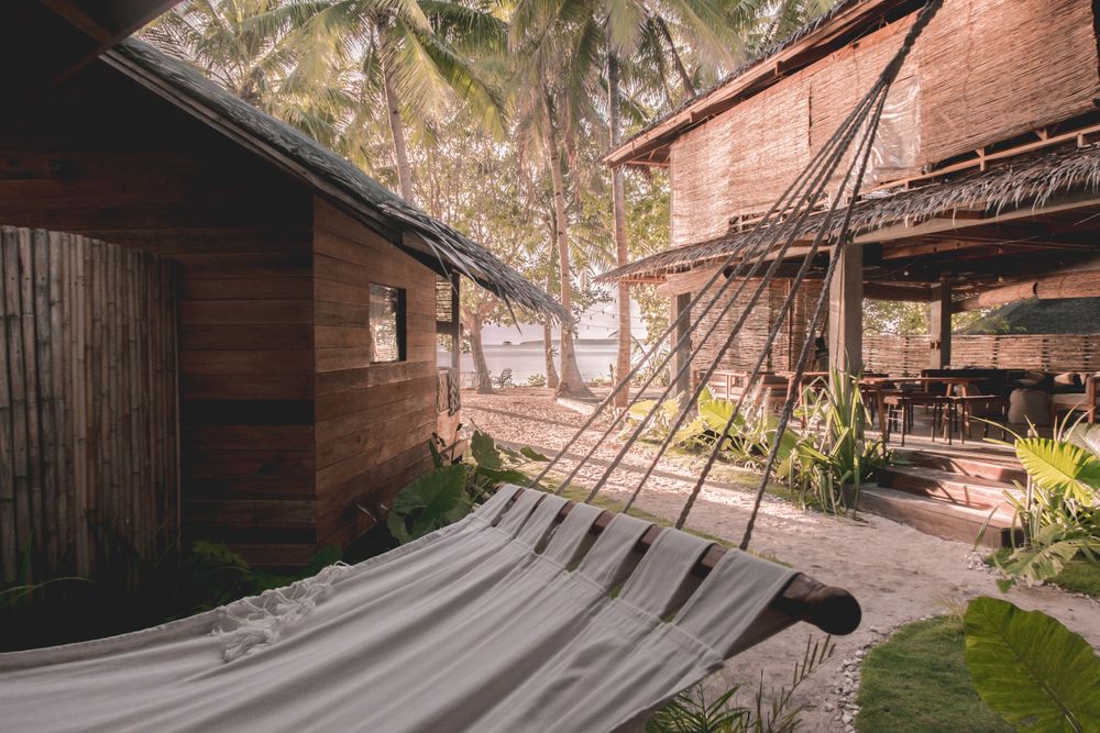Hammock near two bungalows