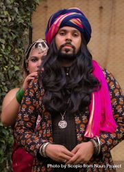 Indian man with long hair wearing a turban and woman standing right behind him bekal5