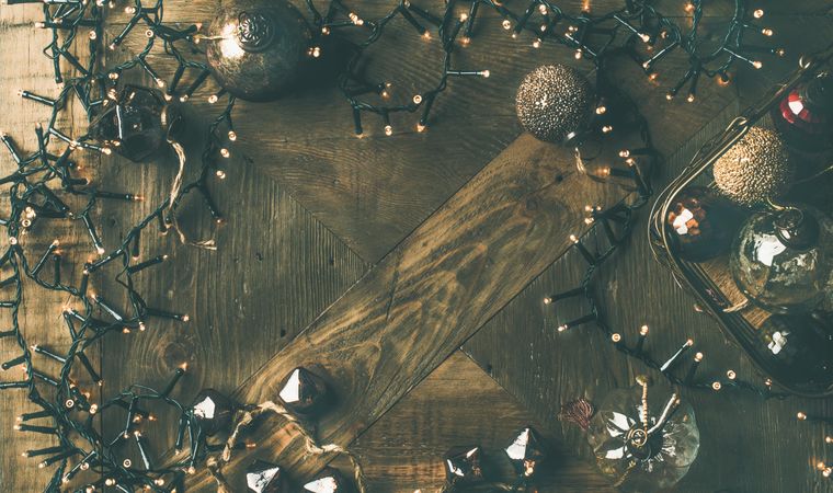 Christmas tree decorations on wooden counter, wide composition, copy space