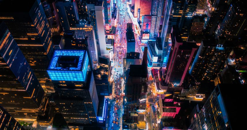 New York Concrete Jungle at Night. Aerial Photo from a Helicopter Tour Around Manhattan. Scenes with Modern Skyscraper Blocking the View on Crowded Times Square Area with Tourists