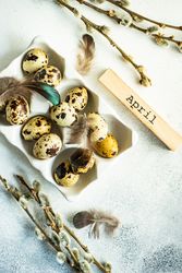Easter card concept with carton full of small speckled eggs