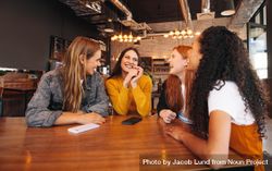 Group of female friends meeting in a coffee shop 5q9MY5