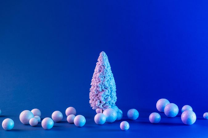 Snowy Christmas tree and baubles in vibrant bold gradient holographic colors
