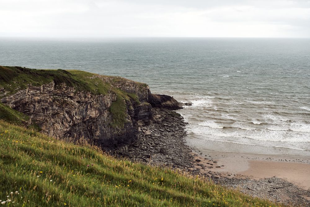 Grass topped cliff over the sea
