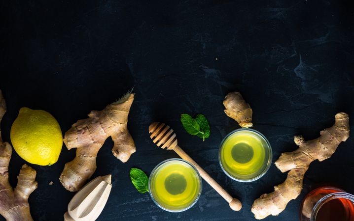 Top view banner of detox drinks with lemon, ginger and mint with copy space