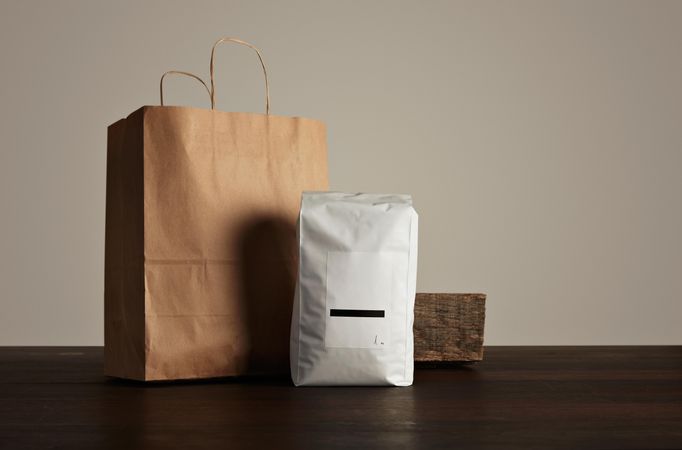 Bag of coffee beans and brown paper bag