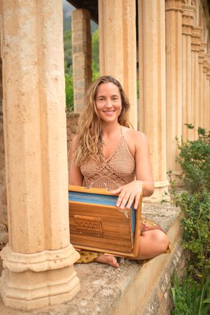 Happy woman with meditation box