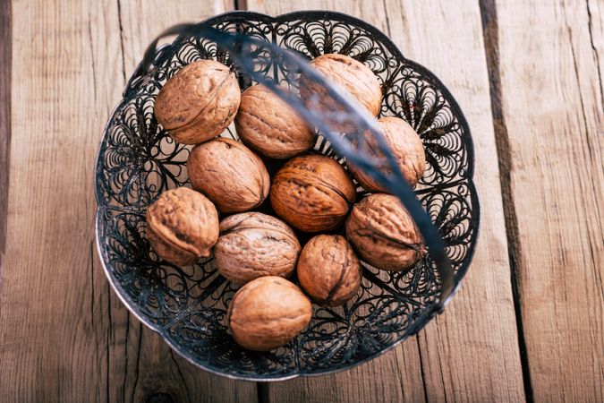 Ornamental basket with walnuts
