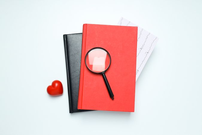 Medical literature - books and doctors accessories on light background