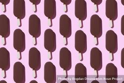 Chocolate popsicle in neat order on pink background 0gz9eb
