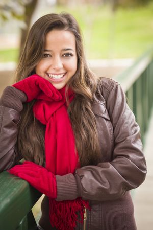 Portrait of Woman Wearing Red Scarf and Mittens Outside