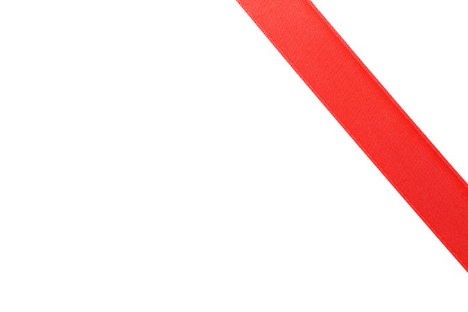 Red ribbon isolated on blank background. Gift concept