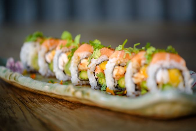 suramaki sushi with salmon and fresh vegetable with avocado on marble tray