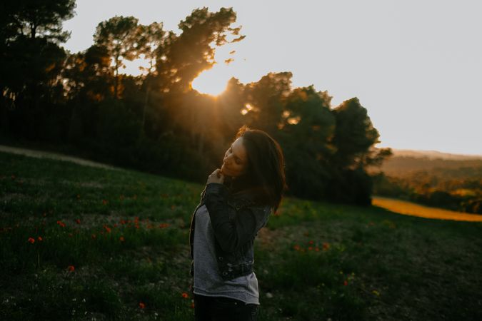 Woman walking on meadow and enjoying freedom