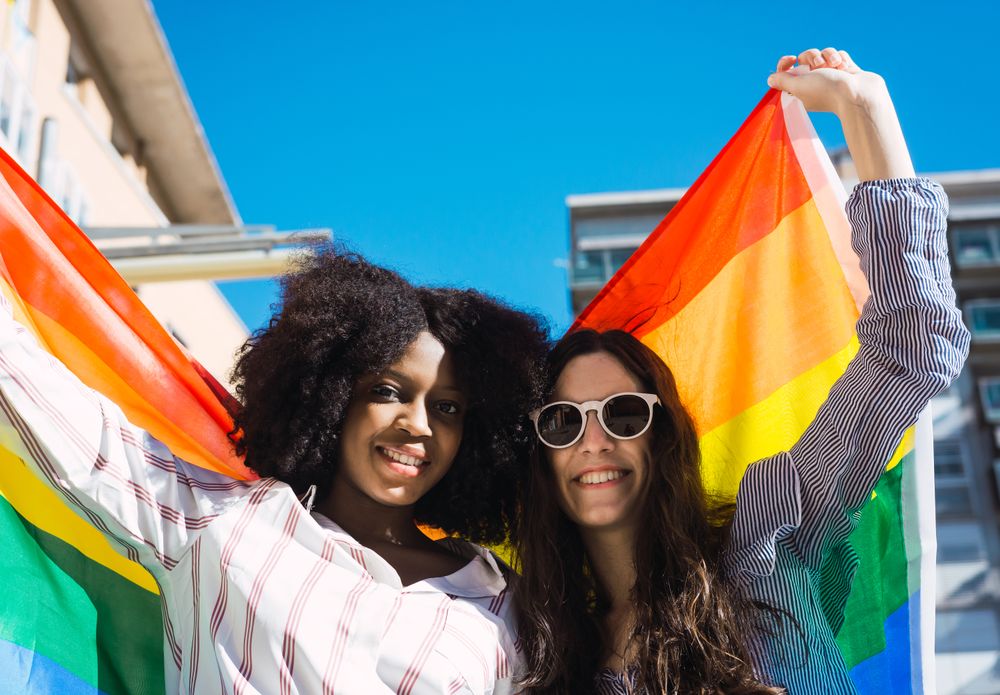Female couple with LGBT flag