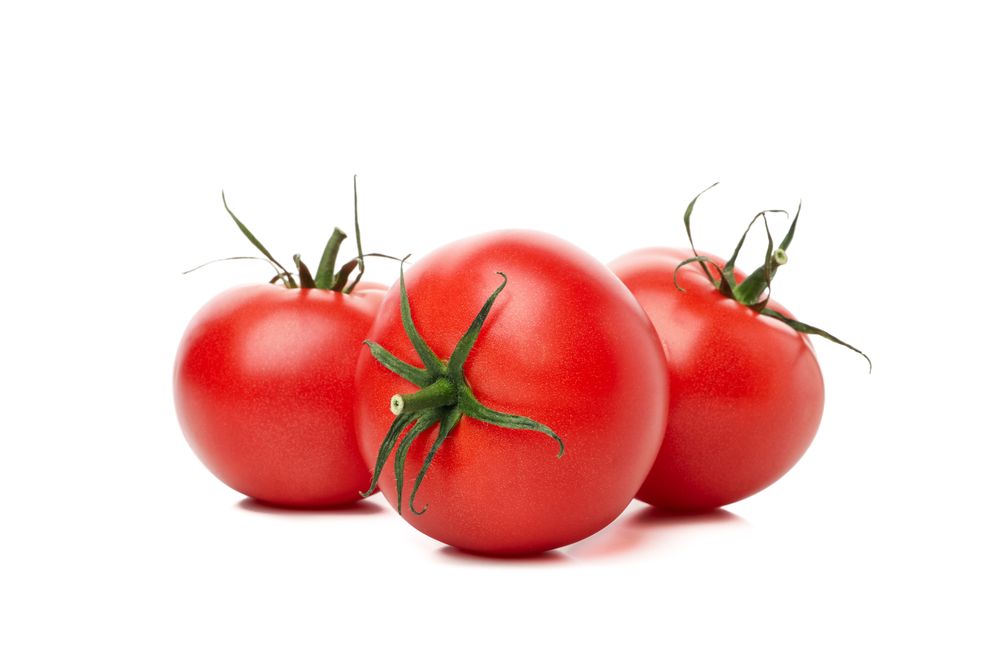 Fresh ripe tomatoes isolated on plain background