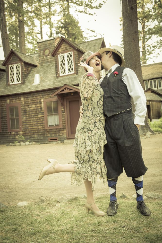 1920s Dressed Romantic Couple in Front of Old Cabin
