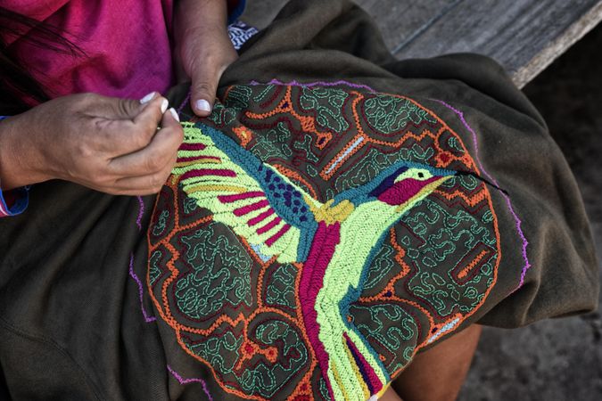 Cropped hand of a woman doing embroidery