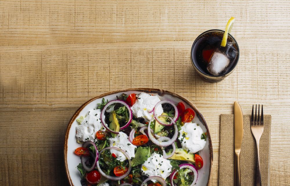 Vegetables salad with onion greens and cream sauce