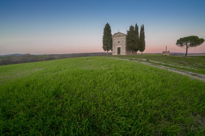 Single chapel among trees on field