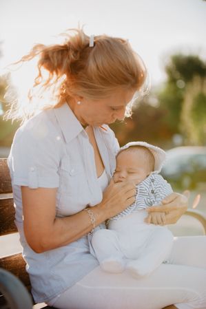 grandmother holding her grandson with down syndrome