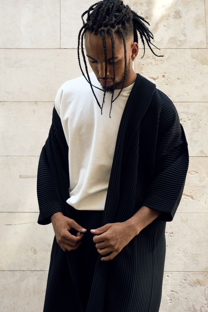 Trendy Black man posing on street
