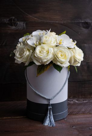 Decorative gift box with roses and orchids